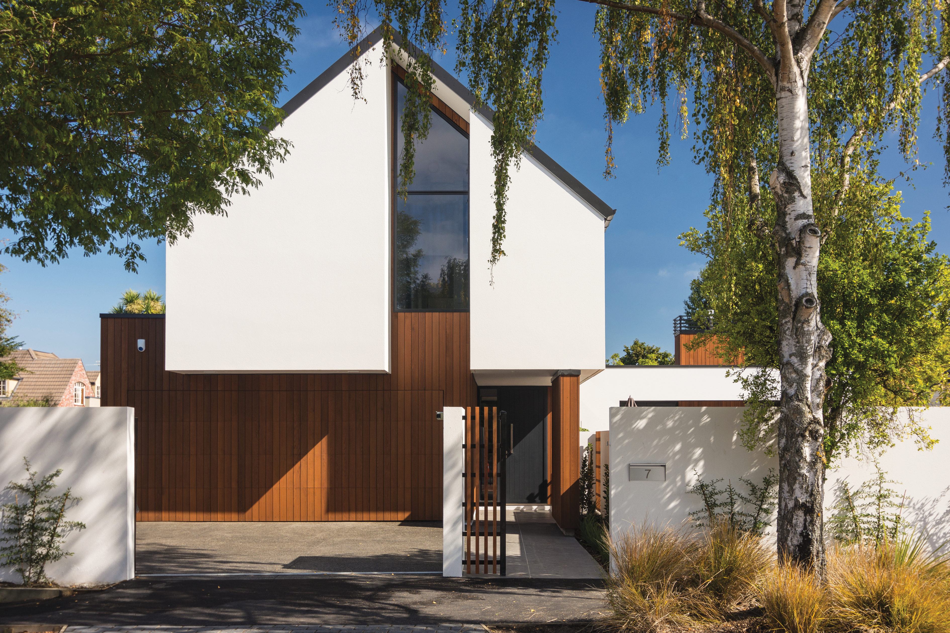 Modernist, geometric St. Albans home front-on in bright sunlight
